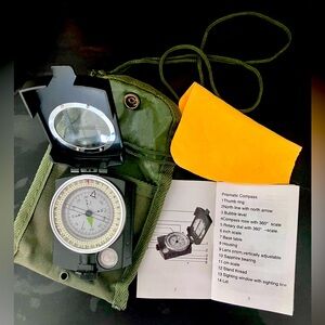 Brand new compass with travel pouch and cleaning cloth